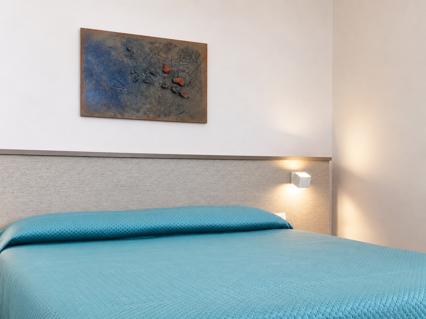 Doppelbett im Essential Dreibettzimmer